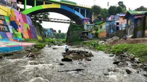 Aerial Drone Flight Over Brantas River with Local People Fishing in Colorful Vídeo Stock 342606000