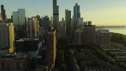 Aerial drone flight over Chicago south loop during golden hour sunset with .. 動画素材 334835072