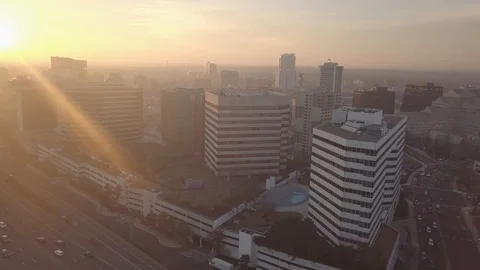 Aerial Drone flight over the city sunrise Stock Footage