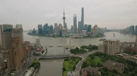 Aerial drone flight over colonial style Bund buildings and Shanghai skyline Stock Footage 67530404