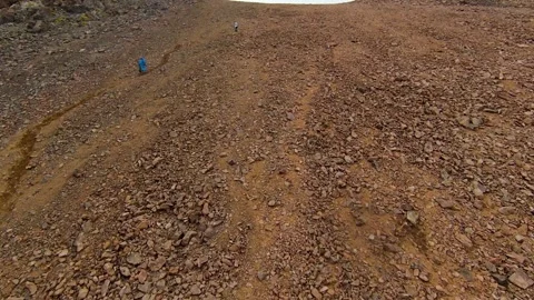 Aerial drone flight over a dramatic mountain ridge with low clouds in Kazakhstan Stock Footage 340423164