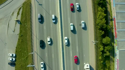 Aerial drone flight over evening road traffic. Two-level road junction. Top view Stock Footage 134974568