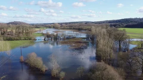 Aerial drone flight over flooded Evel river near Baud Stock Footage 330669189