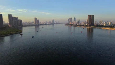 Aerial drone flight over Han River with Da Nang skyline at sunrise, Vietnam Stock Footage 340874665