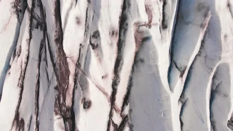 Aerial drone flight over the ice surface of a glacier 库存影片 130853371