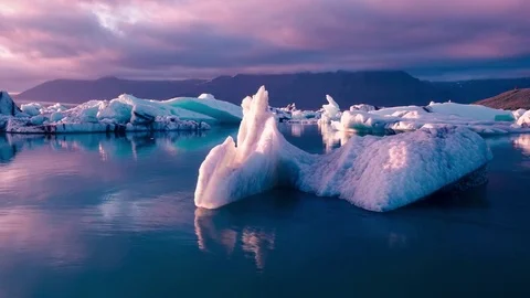 Aerial Drone Flight Over Iceberg Pieces Melting In A Beautiful Ice Lake Majestic Stock Footage