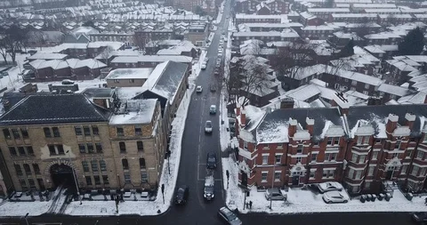 Aerial drone flight over an intersection in London, England during a snowstorm. Video stock 87168655