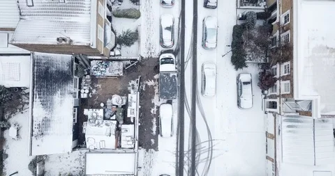Aerial drone flight over an intersection in London, England during a snowstorm. Stock Footage 87168714