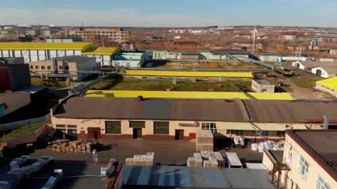 Aerial drone flight over a large warehouse with pallets finished products Stock Footage 130668268