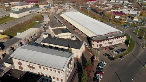 Aerial drone flight over a large storage with pallets finished products Stock Footage 130668292