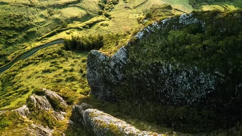 Aerial drone flight over lush green volcanic mountain landscape. Stock-Footage 341072333