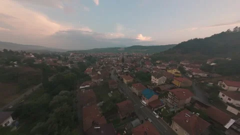 Aerial drone flight over mountain town of Belitsa in Bulgaria at sunset. Stock-Footage 343686380