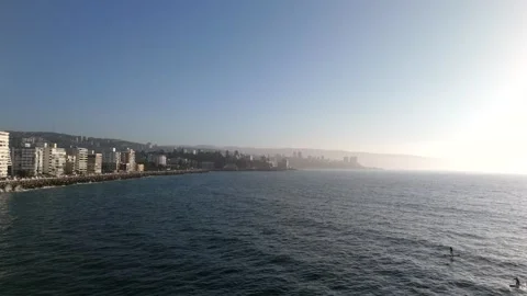 Aerial Drone Flight Over Ocean at Sunset: City on Horizon (Viña del Mar) Video stock 322697156