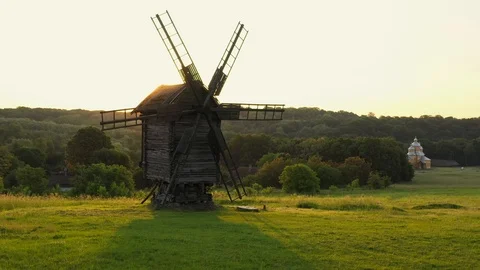 Aerial drone flight over old mill at sunrise, Park Museum Pirohovo, Kyiv Stock Footage 117368170