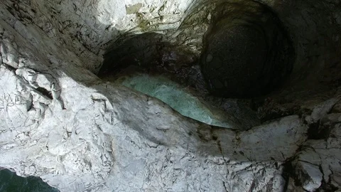 Aerial drone flight over river in a valley with rocks between green fir tree Video stock 91016475