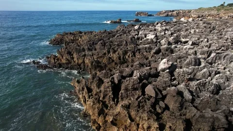 Aerial drone flight over rocky Cascais seacoast Stock Footage 219327247