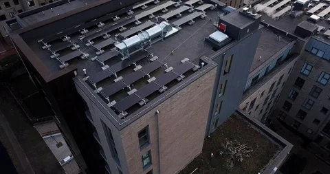 Aerial drone flight over  rooftops covered in solar panels London England. Stockbeeldmateriaal 86009183