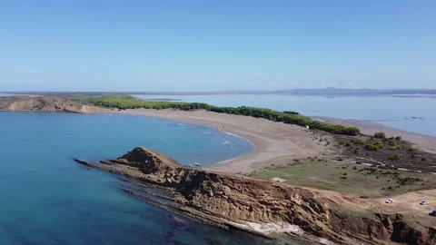 Aerial drone flight over sandy spit beach in Albania during warm autumn day Stock Footage 327977660