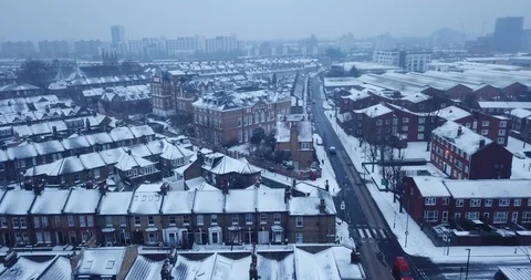 Aerial drone flight over south London, England in a snowstorm. Stock Footage 86575649