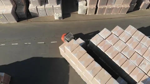 Aerial drone flight over the storage with pallets finished products Video stock 130668339