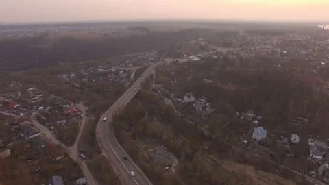 Aerial drone flight over suburban area at small town highway Stock Footage 113687501