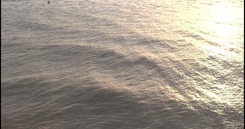 Aerial Drone Flight over Sunlit Sea with Buoy in Suffolk Stock-Footage 320182376