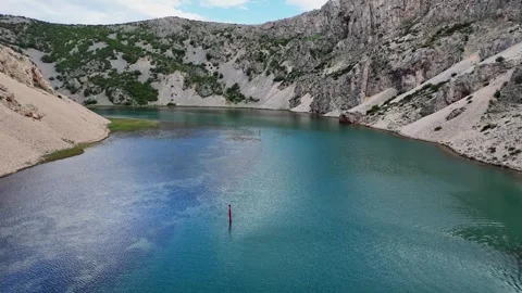 Aerial drone flight over turquoise river canyon in Croatia Stock Footage 337628252
