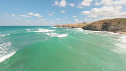 Aerial drone flight over turquoise waves along Veleka Beach coastline, Bulgaria. Stock Footage 342584293