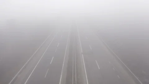 Aerial drone flight over two-way highway in fog, Odessa, Kyiv, Ukraine, , 4k Stock Footage 123436952