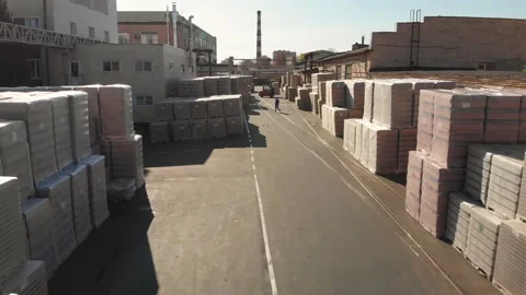 Aerial drone flight over the warehouse with pallets finished products Stock Footage 130668342