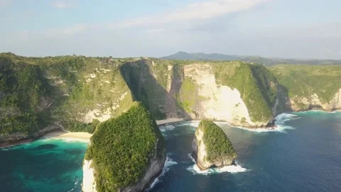 Aerial drone flight over waves near cliff, Nusa Penida, Indonesia, 4k. Overhead Video stock 221087396