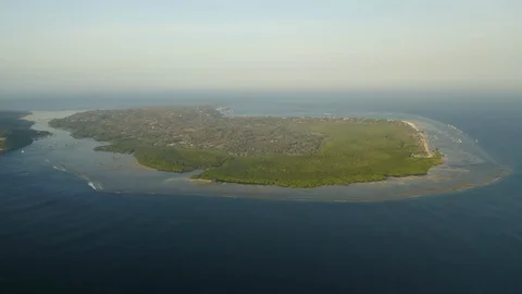 Aerial drone flight over wild island heart shape near Bali, Indonesia, 4k Stock Footage 129902801