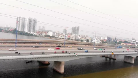Aerial drone flight overhead view of the city bridge with cars and motorcycles Stock Footage 142495450