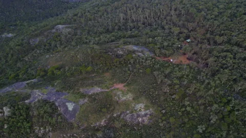 Aerial drone flight panning down above campsite high altitude Stock Footage 161136373