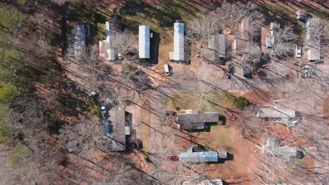 Aerial drone flight straight down view of mobile home trailer park Stock Footage 177075089