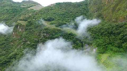 Aerial drone flight through clouds in green forest mountains of Andes. Peru Stock Footage 105885189