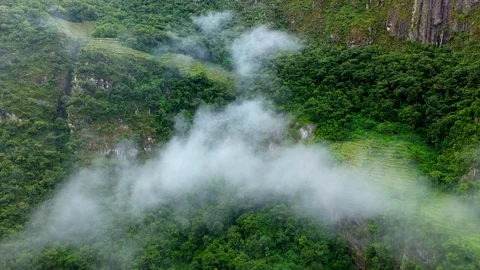 Aerial drone flight through clouds in green forest mountains of Andes. Peru Stock Footage 105885316