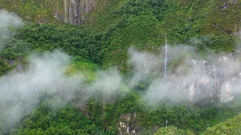 Aerial drone flight through clouds in green forest mountains of Andes. Peru Stock Footage 105885358