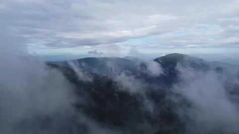 Aerial drone flight through clouds over Carpathian Mountains after rain Stock Footage 336631636