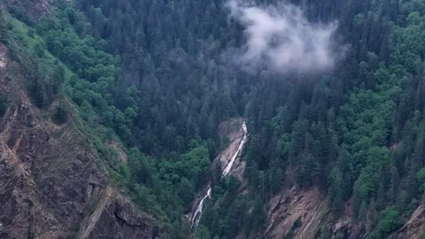 Aerial Drone Flight Through Misty Forest Valley and High Mountains Stock Footage 326944357