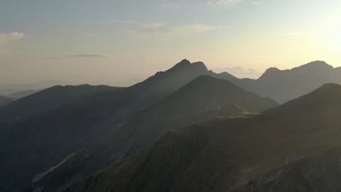 Aerial Drone Flight Through Mountain Landscape View Towards Sunset Vídeos de archivo 116668226