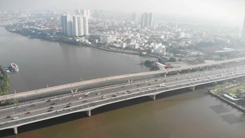 Aerial drone flight a top view of an early sunny morning on city bridge with Stock Footage 142522489