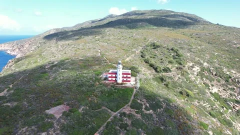 Aerial drone flight view Capel Rosso Lighthouse Giglio Island Italy Stock Footage 244945323