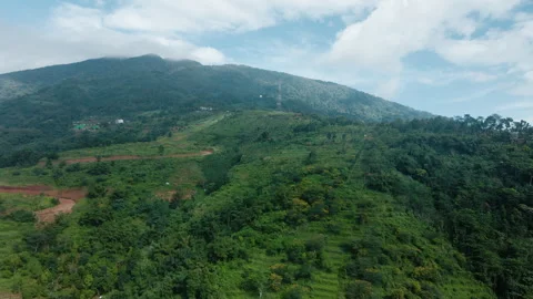 Aerial Drone of Fluffy Clouds over Mountain Peaks Stock Footage 309181971