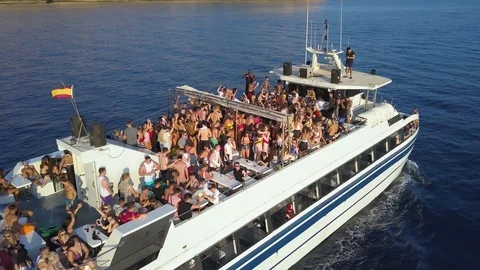 Aerial drone fly around moving party boat booze cruise Stock Footage 101715981
