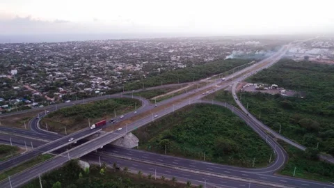 Aerial Drone Fly Backward over Highway Interchange at Dusk Stock Footage 344913713