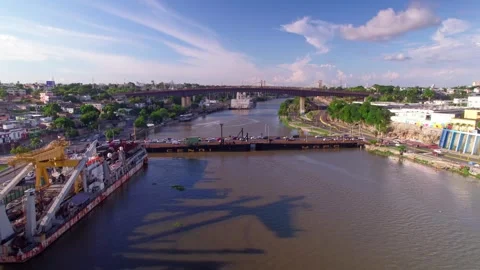 Aerial Drone Fly Forward over Floating Bridge and Ozama River Stock Footage 344917711
