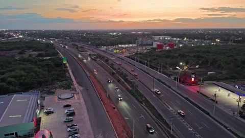 Aerial Drone Fly Forward over Highway and Gas Station at Sunset 스톡 동영상 345027871
