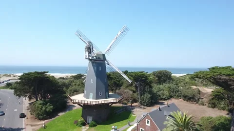 Aerial Drone Fly over beach dutch windmill green Stock-Footage 67335575