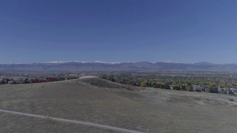 Aerial Drone Fly-over CO buffalo grass Reveal Front Range Mountain Bikers Stock Footage 85064329